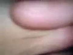 A close-up of me tugging my breasty wife's enormous breasts in a movie